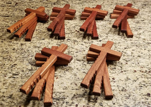 Powerful handheld Christian cross with finger grips.  The beautiful religious cross is 12" x 6" of solid mahogany.