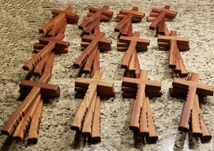 Powerful handheld Christian cross with finger grips.  The beautiful wooden cross is 12" x 6" of solid mahogany.