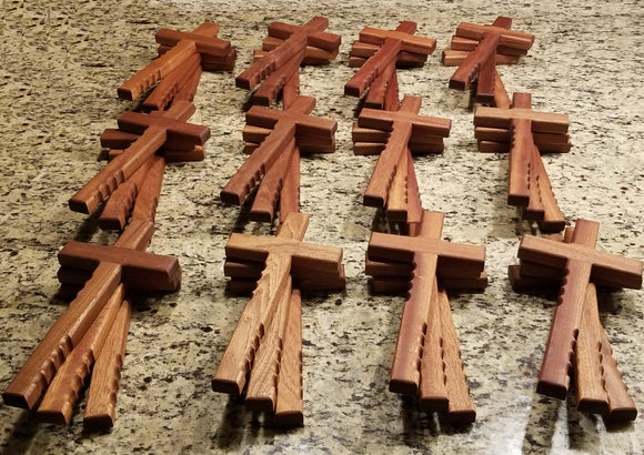 Powerful handheld Christian cross with finger grips.  The beautiful wooden cross is 12